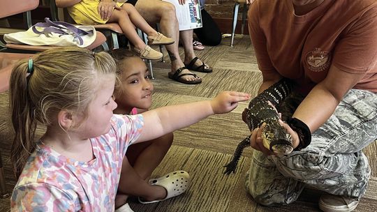 Heather from Delta Rivers Nature Center and Little Man the Alligator