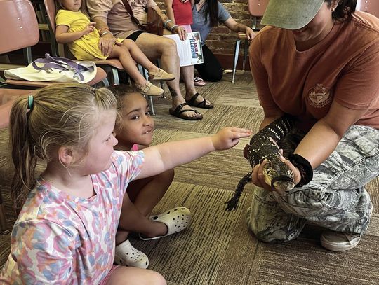 Heather from Delta Rivers Nature Center and Little Man the Alligator